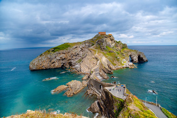 landscape of San Juan de Gaztelugatxe the wall and 241 stairs with blue sea. Basque Country. Spain