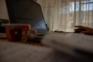 Rome, April 19, 2020. The coronavirus has forced many people to work from home, pc cups of coffee...