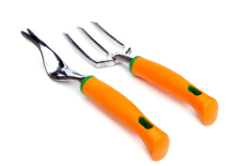 Garden tools . Garden root remover and fork isolated on a white background. Root remover and fork for gardening.