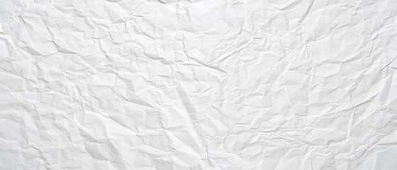 Texture of a white crumpled sheet of paper as a background