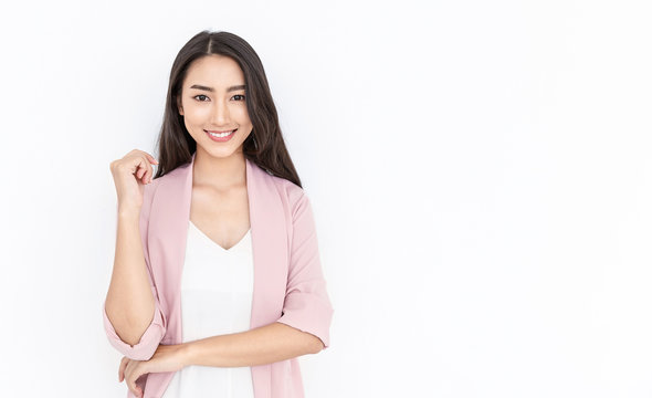 Portrait Of Smiling Confident Asian Business Woman In Pink Suit Office. Asian Business Girl. Startup Successful Power Business Leader Executive People Looking Camera With Copy Space Isolated On White