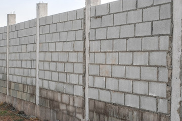 Fototapeta premium White cement brick wall pattern close-up.