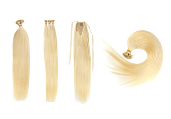 Set of 4 fake women hair extensions in tails, isolated on white background. Light blonde or gold color. and different attachment types.
