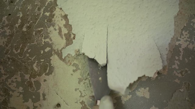 Scrape off the wallpaper with a spatula