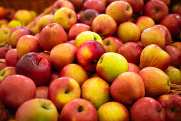red gala apples on the supermarket counter background