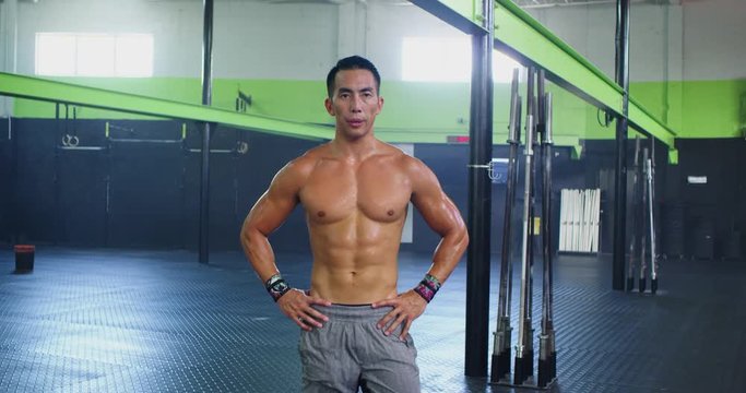 Strong asian man sweaty after workout