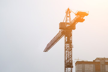 Extensive scaffolding providing platforms for work in progress on a new apartment block,Tall...