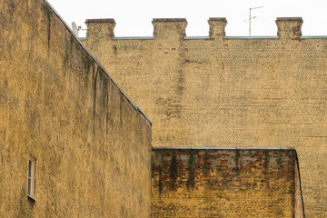 The background of the yellow wall of the old house