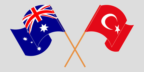 Crossed and waving flags of Australia and Turkey