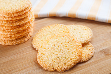 Group of cookies with sesame seeds on wooden board. healthy food. Close up view