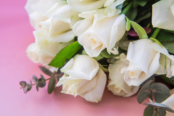 Close Up Of Little Bouquet Made Of White Rose Flowers On A Pink Gradient Background With Copy Space