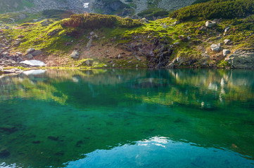 Mountain lake landscape, blue crystal clear water