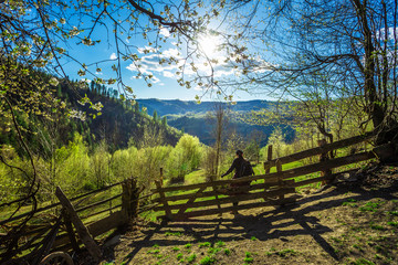 Beautiful spring landscape in rural Romania, trees in bloom and old traditional houses