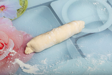 woman makes dough for making bread at home