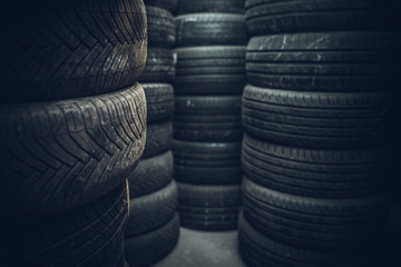 Tire sets in a car repair shop ready for a seasonal change on cars.