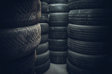 Obraz premium Tire sets in a car repair shop ready for a seasonal change on cars.