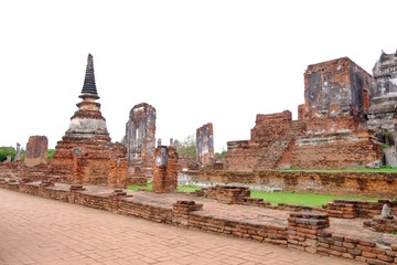Ruin ancient pagoda at Wat Phra Sri Sanphet in Ayutthaya historical park area against white blue sky background in bright day 