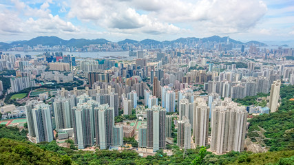 Wide angle aerial view of Kowloon City Hong Kong fromthe Lion Rock overlooking concrete jungle of Hong Kong