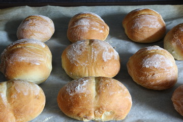 Baking rolls - hot crisp rolls removed from the oven