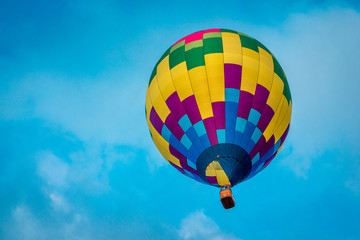 Close up shot of hot air balloon flying in the sky at an airshow in Michigan