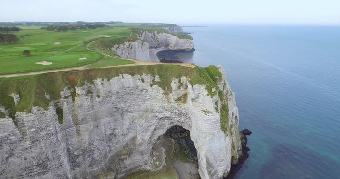 Cliffs of Etretat in Normandy, France. Clify white work of nature, photos from the drone, view of the rocks, beaches, green fields, sea and sun shot in the early season, summer, footage 4k25ftp