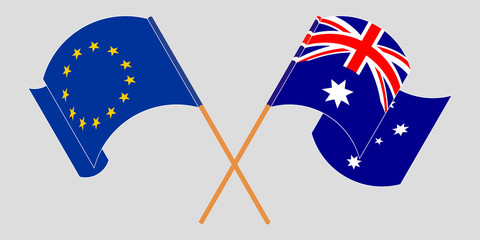 Crossed and waving flags of Australia and the EU