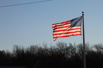 american flag on a wind