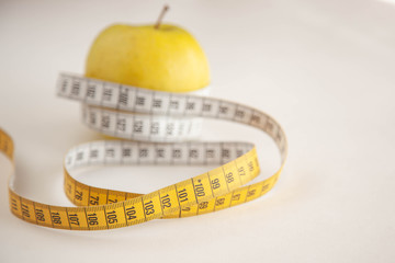 Green apples measured the meter.Healthy food for weight loss.
