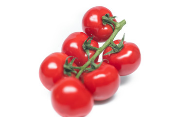 Closeup of fresh red tomato isolated on a white background. Washed tomatoes on the table. Healthy lifestyle. Seasonal and summer vegetables