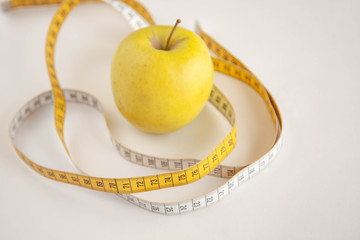 Green apples measured the meter.Healthy food for weight loss.
