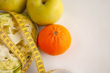 tasty food for weight loss. Slimming vegetables, tangerines and cabbage.