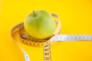 Green apples measured the meter. Healthy food for weight loss.
