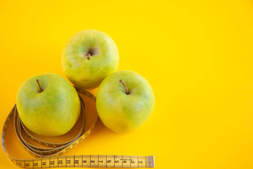 Green apples measured the meter. Healthy food for weight loss.