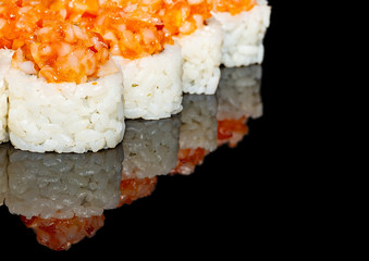 
sushi on a black background with rice filling