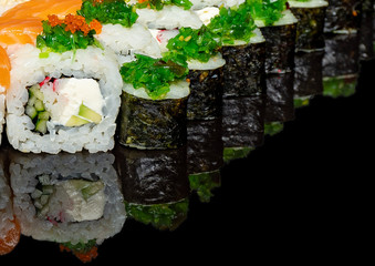 
sushi on a black background with rice filling