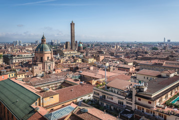 Fototapeta na wymiar Old town of Bologna city, Italy seen from terrace of St Petronius basilica, view with Two Towers and Santa Maria della Vita church