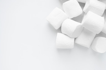 White marshmallows on a white background, top view
