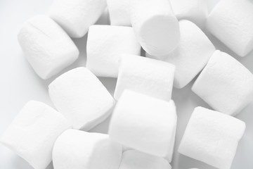 White marshmallows on a white background, close-up
