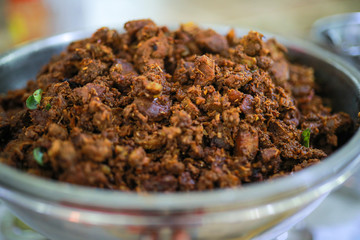 Kerala style beef dry fry. delicious spicy Beef fry in banquet table with chafing dish heaters. It goes well with ghee rice, kappa,appam, parotta, puttu, Kerala style cuisine ,beef roast.India