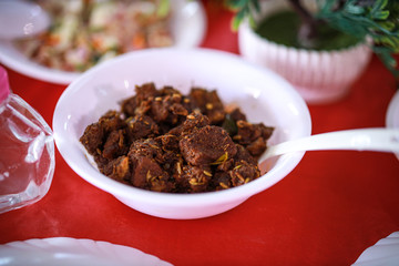 Kerala style beef dry fry. delicious spicy Beef fry in banquet table with chafing dish heaters. It goes well with ghee rice, kappa,appam, parotta, puttu, Kerala style cuisine ,beef roast.India