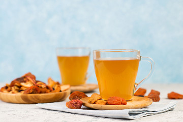 Homemade vitamin compote from dried fruits on concerete background