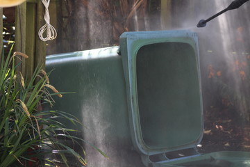 jet washing the wheely bin 
