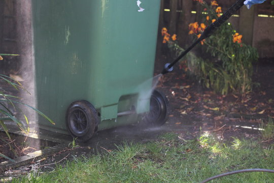 jet washing the wheely bin 