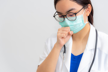 Asian young woman doctor coughing wear mask to safety Coronavirus, Medical cough is a danger signal a virus infection, Concept take care yourself is to help physician stop the epidemic Covid-19 virus