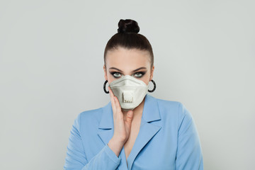 Woman wearing a medical mask on white background