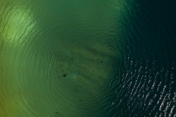 Ripples on dark and light coloured water