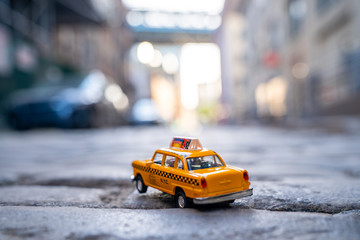 Classical taxi model car parked on an old street in Brooklyn near Brooklyn bridge.