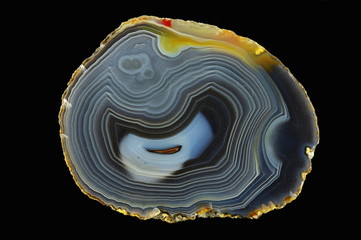 Fortress agate. Numerous colored ribbons colored with metal oxides are visible. Origin: Rudno near Krakow, Poland.