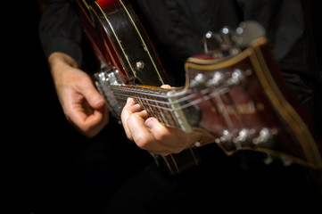 Playing guitar.Jazz composition.The sound of the strings