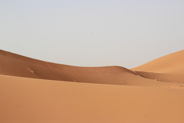 Fototapeta na wymiar Minimal landscape photography of sand dunes in the Merzouga Sahara desert - Morocco